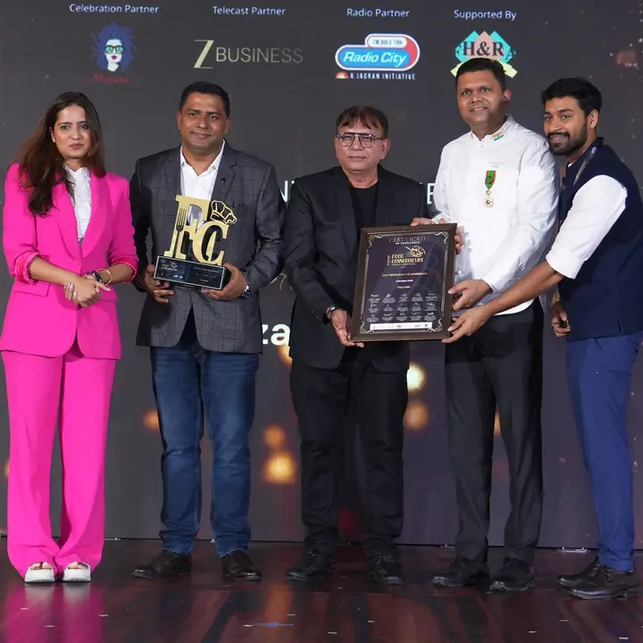 Pizzaiiolo founders receiving the Food Connoisseurs India Awards trophy