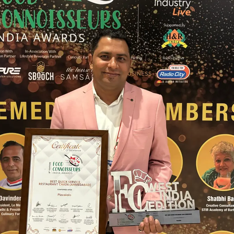 Shriwar Jha, founder of Pizzaiiolo, at an awards ceremony