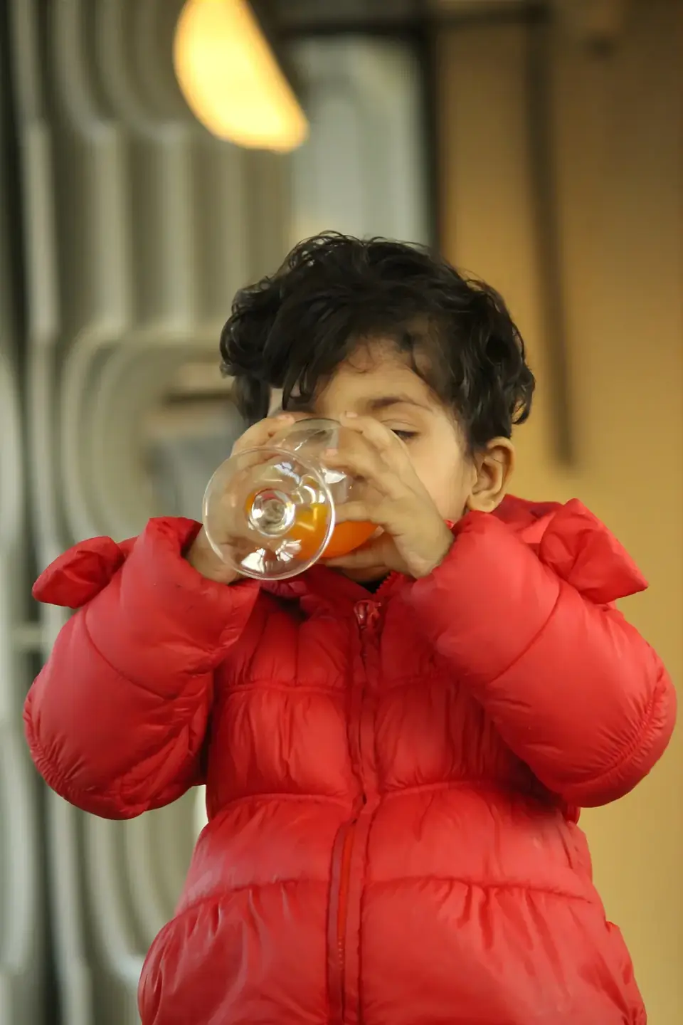 A young guest sipping a mocktail