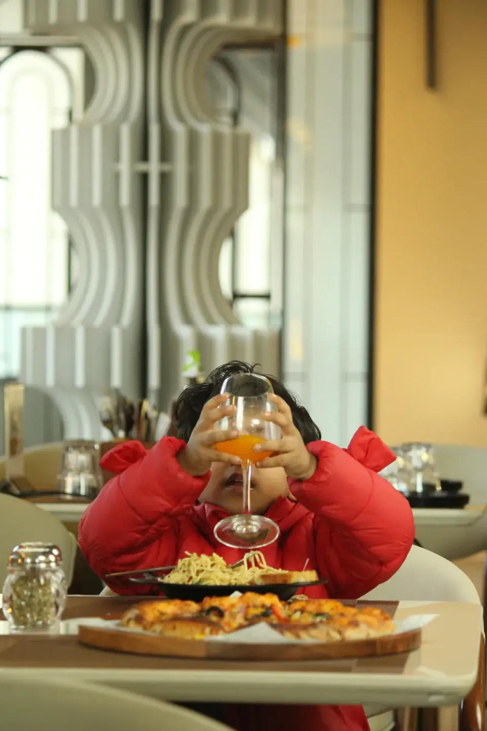 A young guest with a fresh juice
