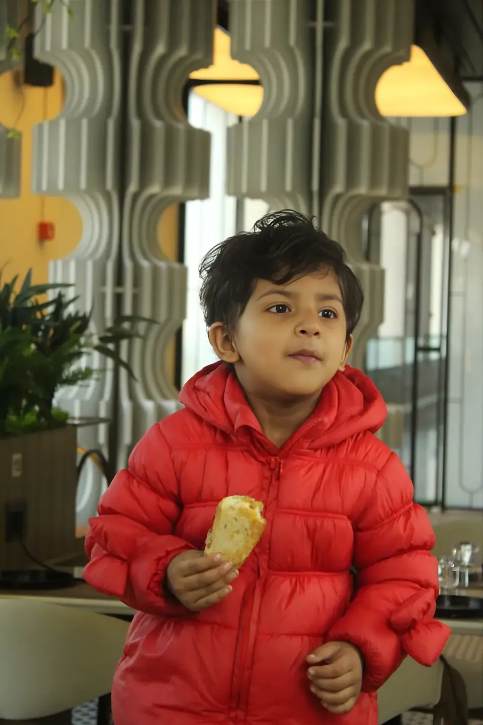 A young guest with garlic bread