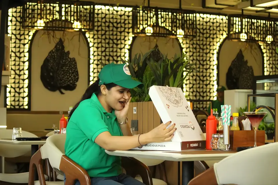 Pizzaiiolo team member at a table