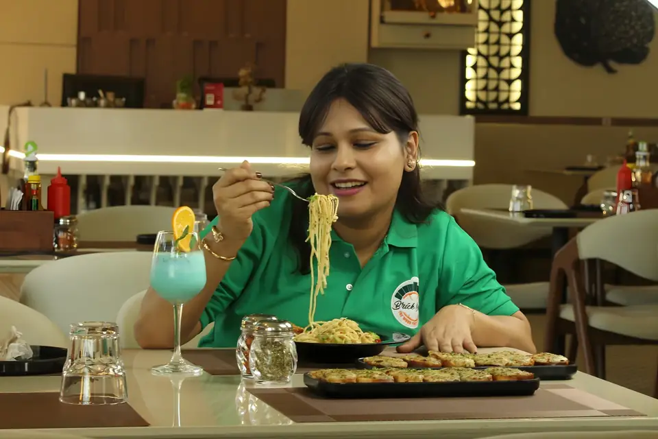 Guest eating pasta at the table
